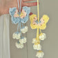 Handmade woven butterfly lily of the valley flower pendant, DIY material kit for making bag charms, keychains, and gifts.