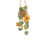 Crocheted hanging decoration with flowers on a white background
