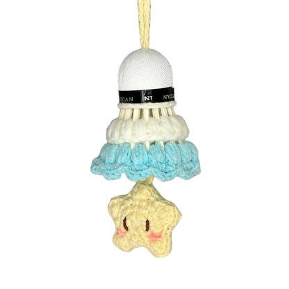 Crocheted badminton shuttlecock with a star-shaped charm on a gray background