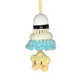 Crocheted badminton shuttlecock with a star-shaped charm on a gray background