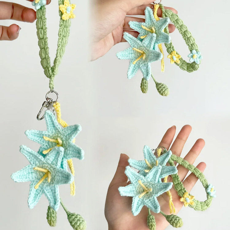 Three crocheted starfish keychains held by hands against a light background