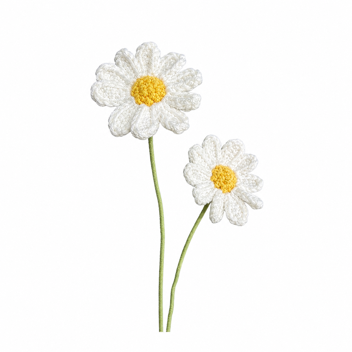 Two crocheted daisy flowers with white petals, yellow centers, and green stems on a plain white background.