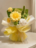 A handmade crochet flower bouquet featuring yellow daisies, a white rose, green cactus-like stems, and textured yellow wrapping paper, displayed on a light beige surface.