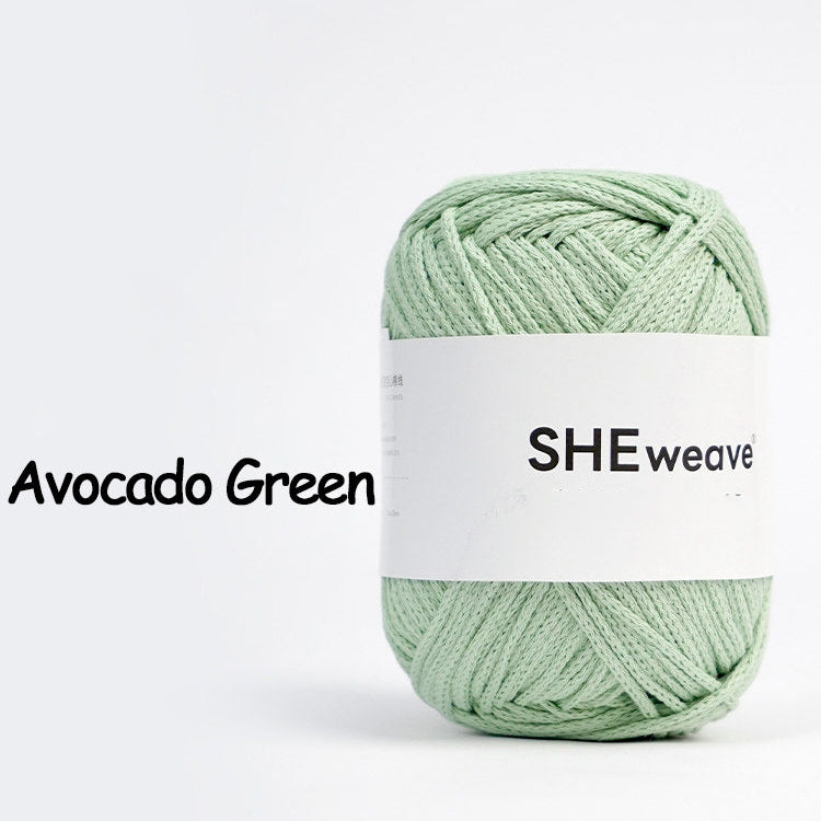 Green yarn ball with 'SHEweave' label on a white background