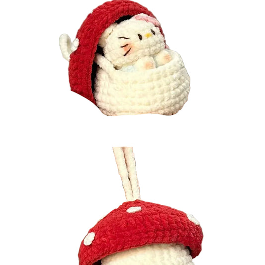 Hand holding a small crochet snowman with a red hat and mushroom base.